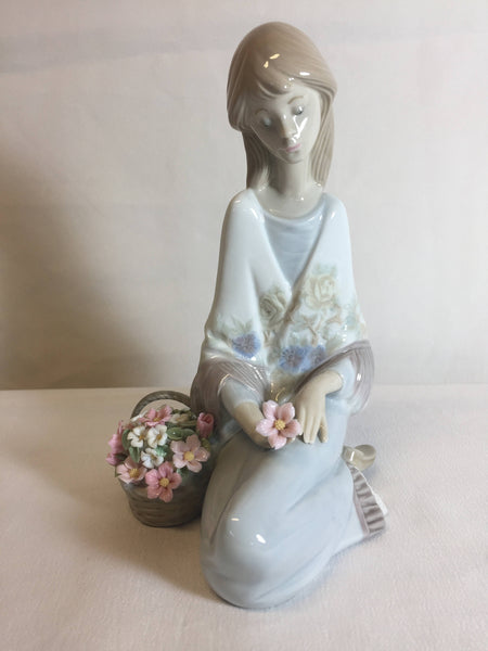 Lladro #7607 Flower Song 1988, girl sitting with flower basket 7" Tall