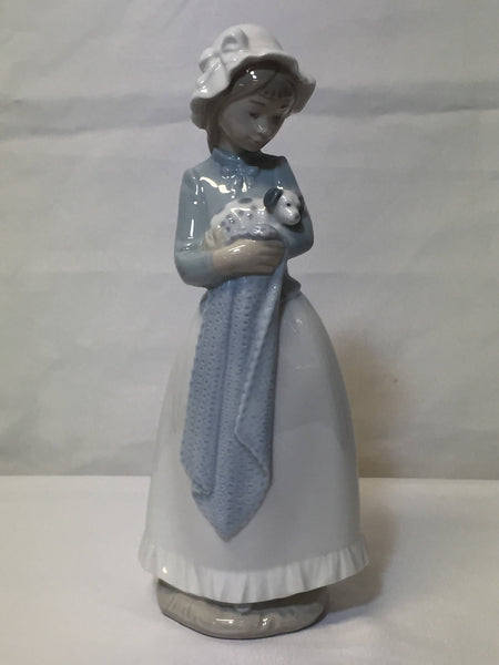 NAO/ LLADRO, porcelain figurine "Girl with a puppy dog." SOLD- SOLD - SOLD