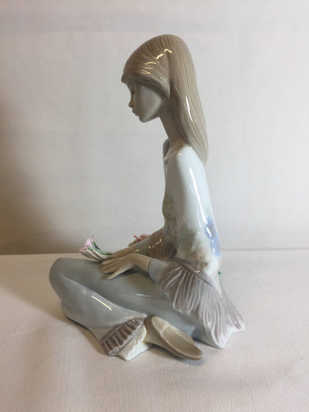 Lladro #7607 Flower Song 1988, girl sitting with flower basket 7" Tall